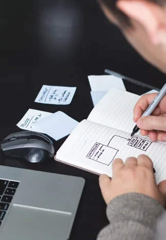 early-stage software design sketches in a notebook
