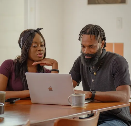 Business partners looking at a laptop